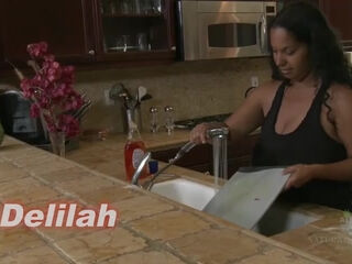 Delilah is one sexy mature MILF masturbating and getting her tits wet