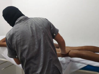 The doctor gives his patient a massage to relieve stress