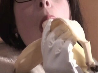 Spex brunette talking dirty while eating banana by Femdom Austria