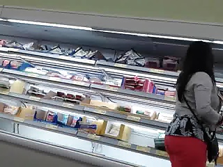 Mature latina at supermarket