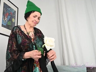 Minia Sniffs A Rose From Her Garden and Masturbates in Lacy Black Stockings