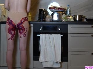 Housewife With Tattoo On Butt Cooks Dinner On Kitchen And Ignores You